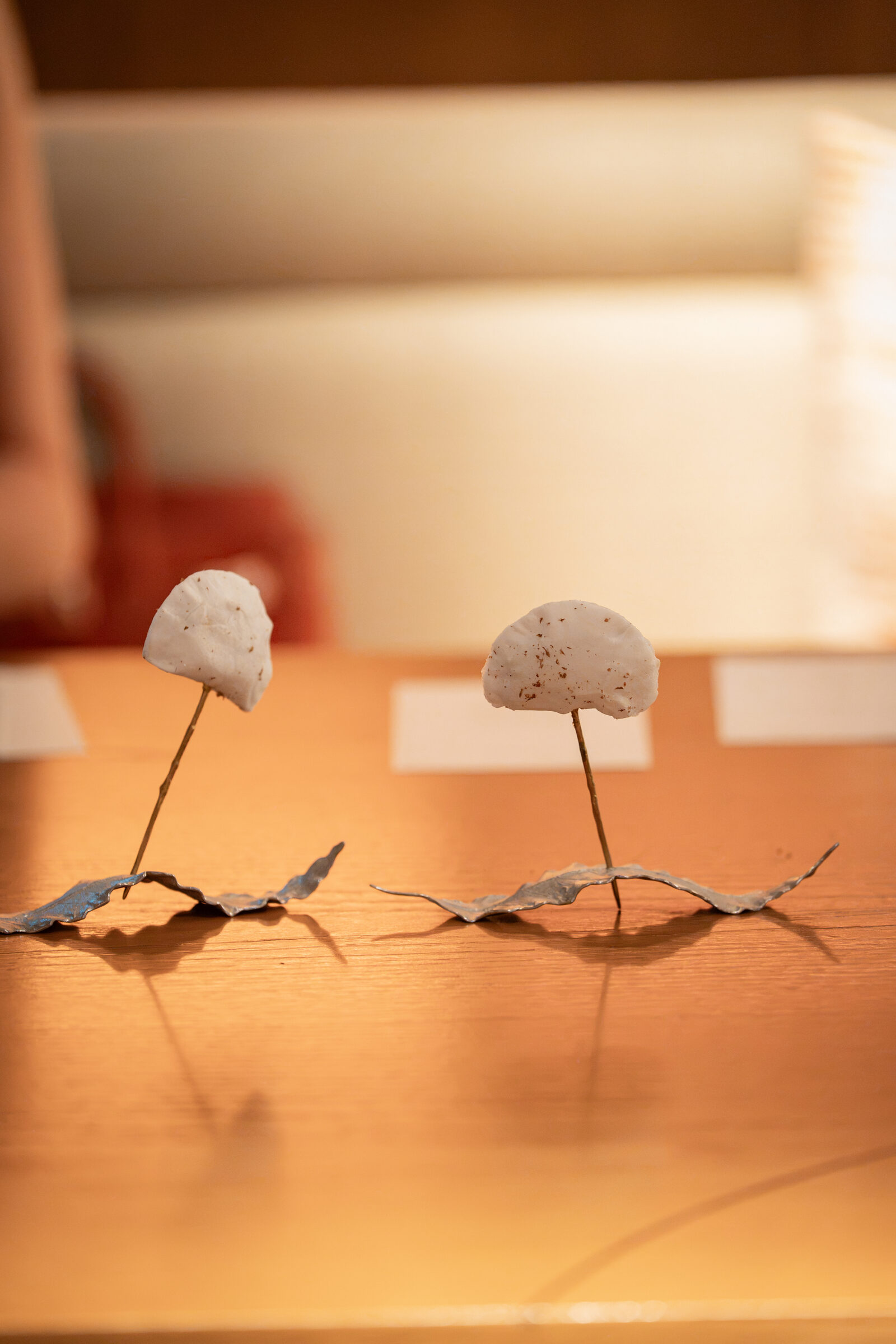 Cotton candy, pickled deodeok, perilla leaf plating — silverware stands